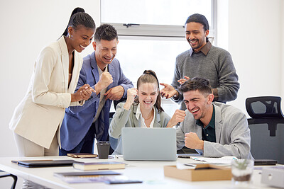 Buy stock photo Shot of a group of businesspeople cheering while using a laptop in an office at work