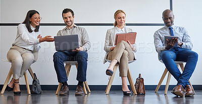 Buy stock photo Shot of a group of businesspeople using different forms of technology while waiting in line at an office