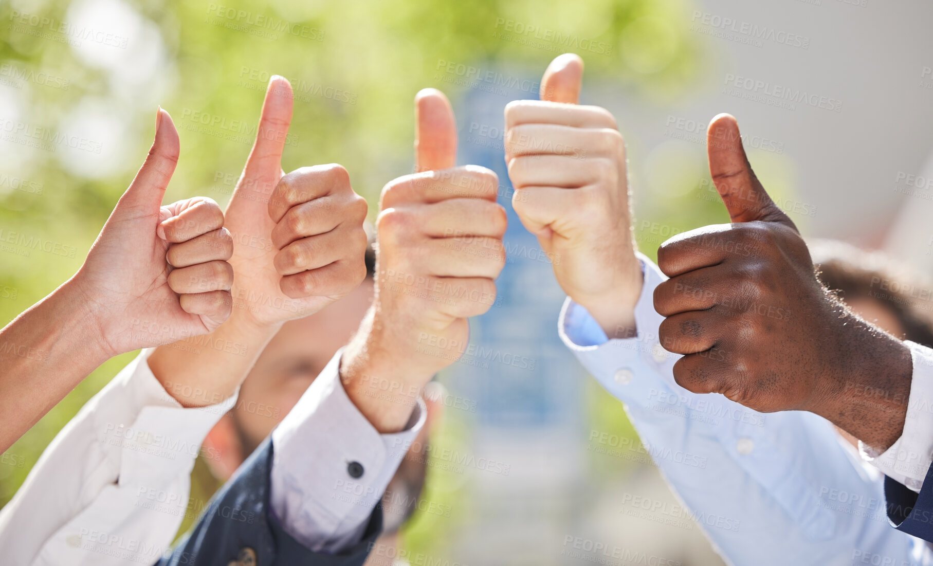 Buy stock photo Shot of a group of unrecognizable businesspeople showing a thumbs up