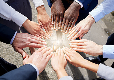 Buy stock photo Hands, teamwork or top view of business people outside in collaboration for mission goals in city. Light, link or employees meeting with strategy, teamwork or support outdoors together in huddle 