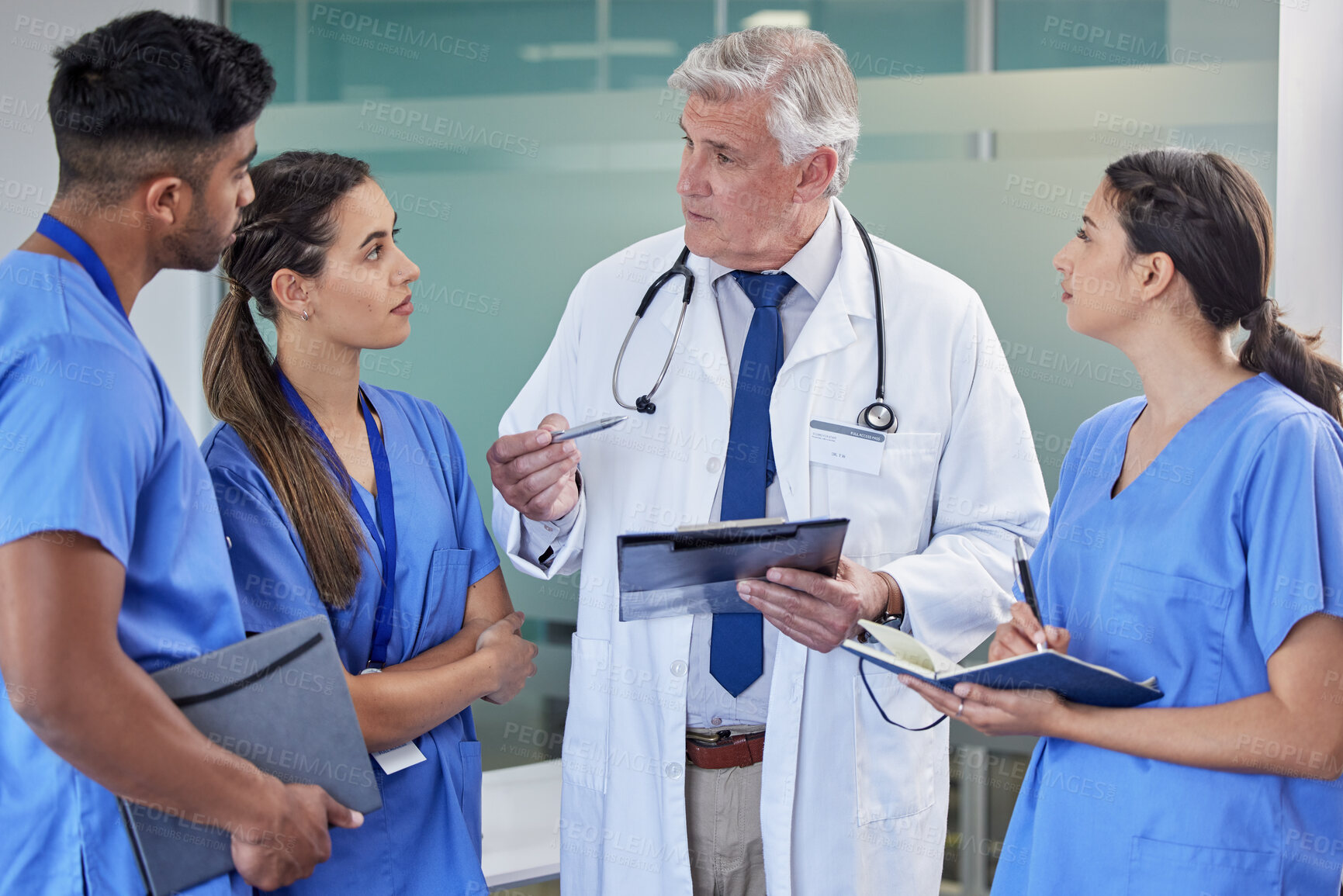 Buy stock photo Teamwork, tablet or doctor and nurses at hospital for surgery schedule, planning or learning support. Clinic, healthcare or mature mentor surgeon with student group for digital, checklist or teaching