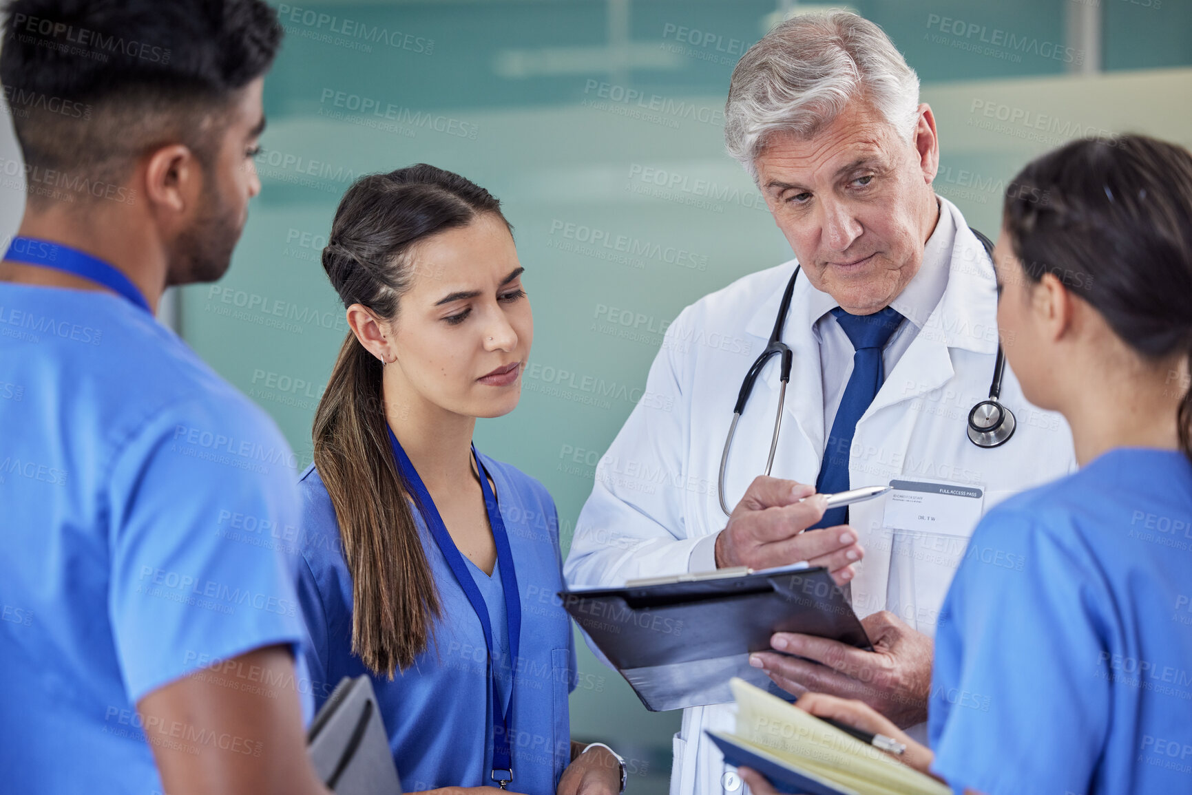 Buy stock photo Healthcare, tablet or doctor with nurse students at hospital for surgery schedule, planning or learning support. Clinic, teamwork and mature surgeon mentor with interns for digital teaching checklist