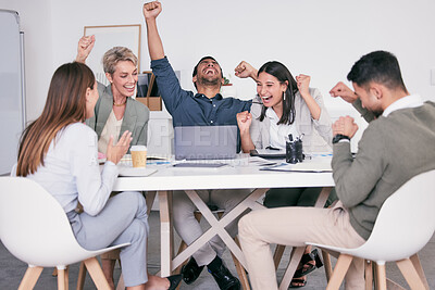 Buy stock photo Shot of a team of business people cheering at the office