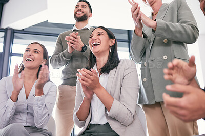 Buy stock photo Shot of a group of businesspeople applauding during a meeting