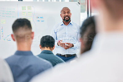 Buy stock photo Presentation, business and speaker with audience at the office for learning about work. Conference, coach and employees are training during a meeting at a company on a board for corporate team.