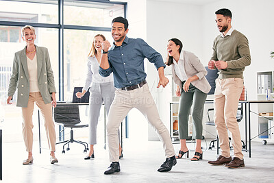 Buy stock photo Full length shot of a diverse group of businesspeople standing together and dancing in the office
