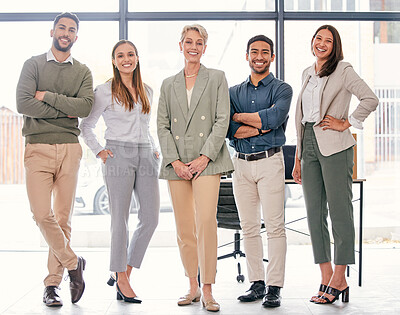 Buy stock photo Full length shot of a diverse group of businesspeople standing together in the office