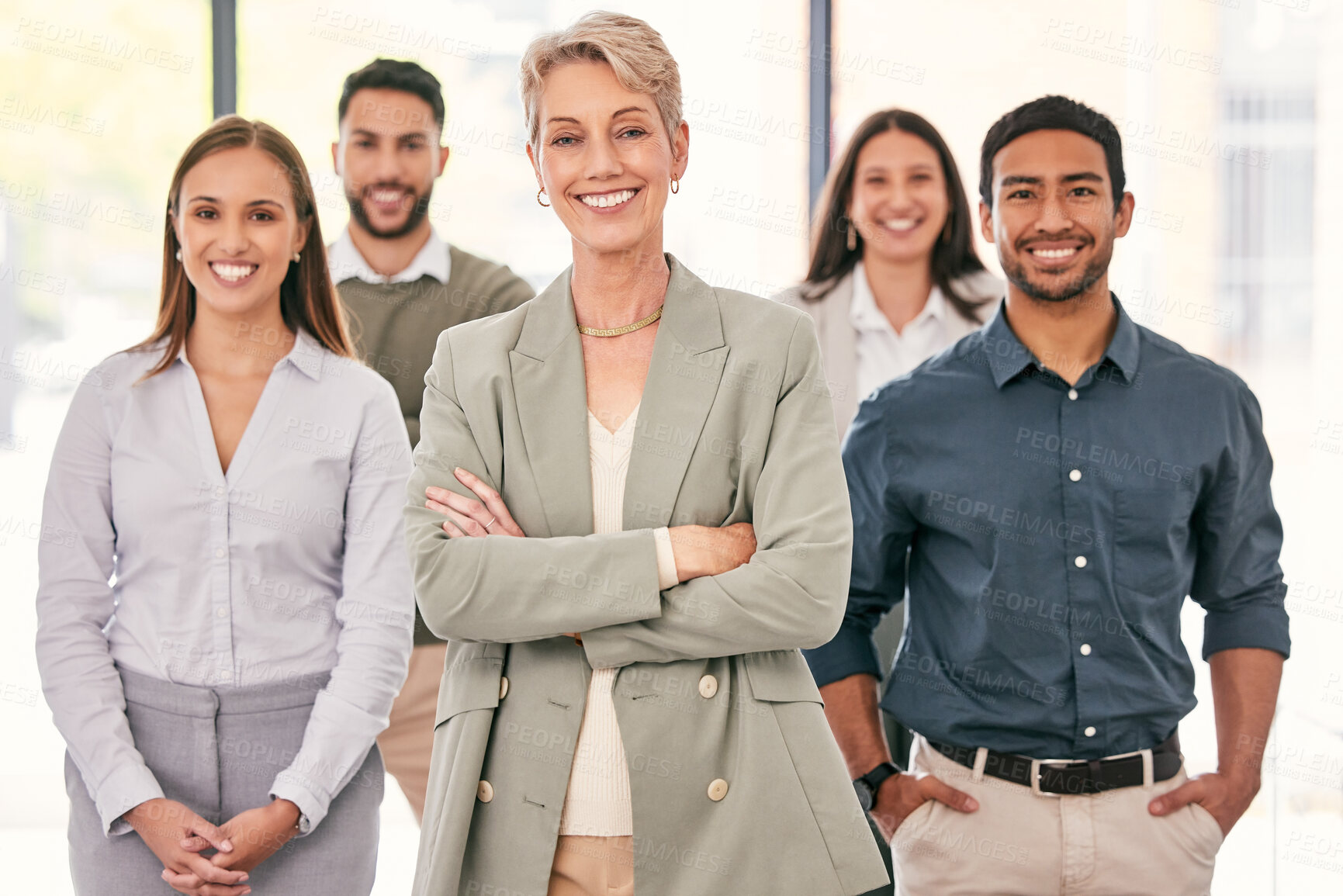 Buy stock photo Shot of a diverse group of businesspeople standing together in the office