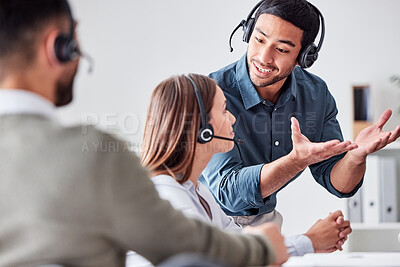 Buy stock photo Cropped shot of a group of young call center agents working together in their office
