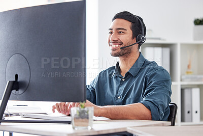 Buy stock photo Cropped shot of a handsome young male call center agent working in his office