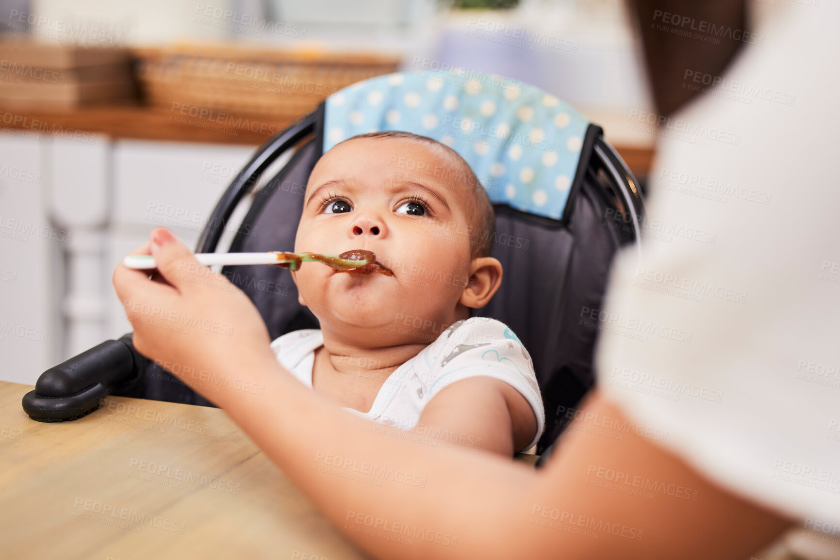 Buy stock photo Mom, feeding and face of baby with food, spoon and health for growth, child development and breakfast in high chair. Diet, nutrition and infant at table with woman for morning eating schedule in home