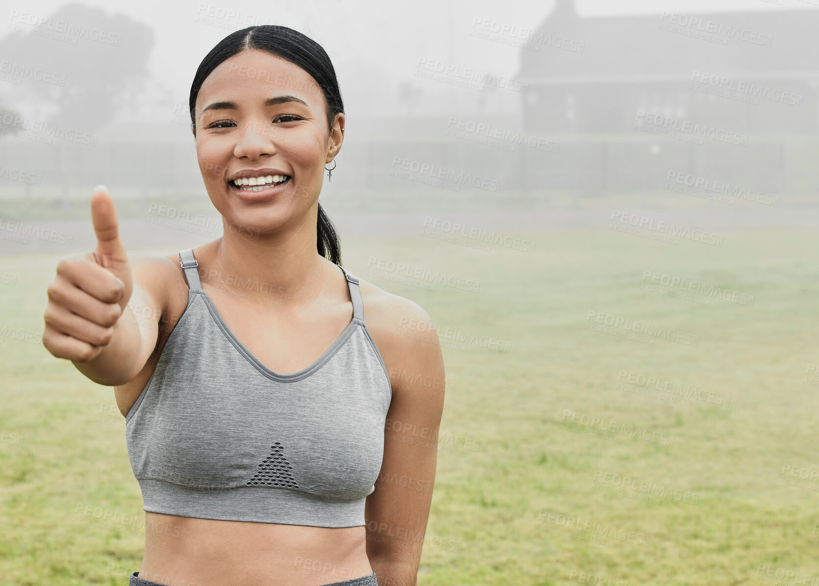 Buy stock photo Woman, portrait and thumbs up outdoor for fitness, wellness and health goals achievement in morning. Female athlete, face and thank you sign on field for workout, training or good exercise experience