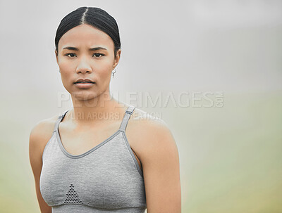 Buy stock photo Cropped portrait of an attractive young female athlete exercising outside