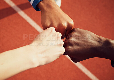 Buy stock photo People, diversity and fist bump in fitness for teamwork, unity or trust together on stadium track above. Hands of group touching fists in team building for sports motivation, agreement or goals