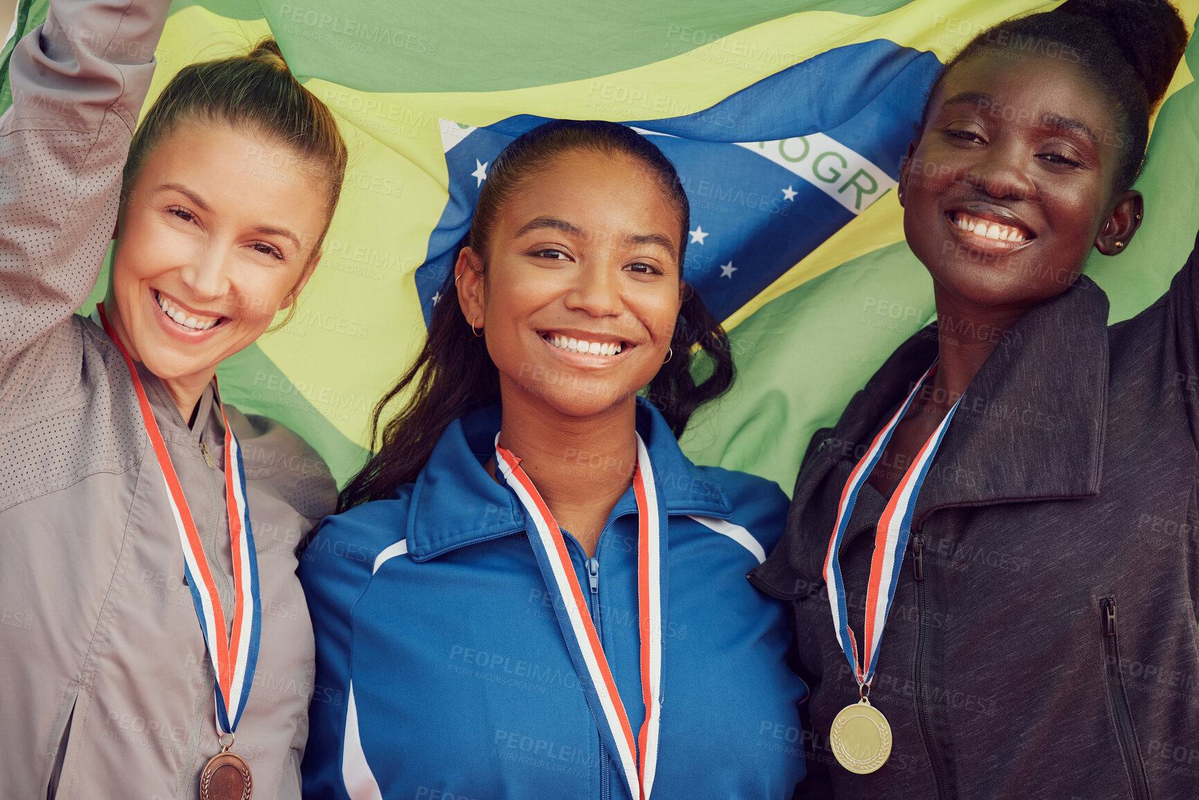 Buy stock photo Winning flag, athlete and portrait of woman team for celebration, achievement and happy for medal. Brazil group, people and smile for success, event victory and relay champion with collaboration