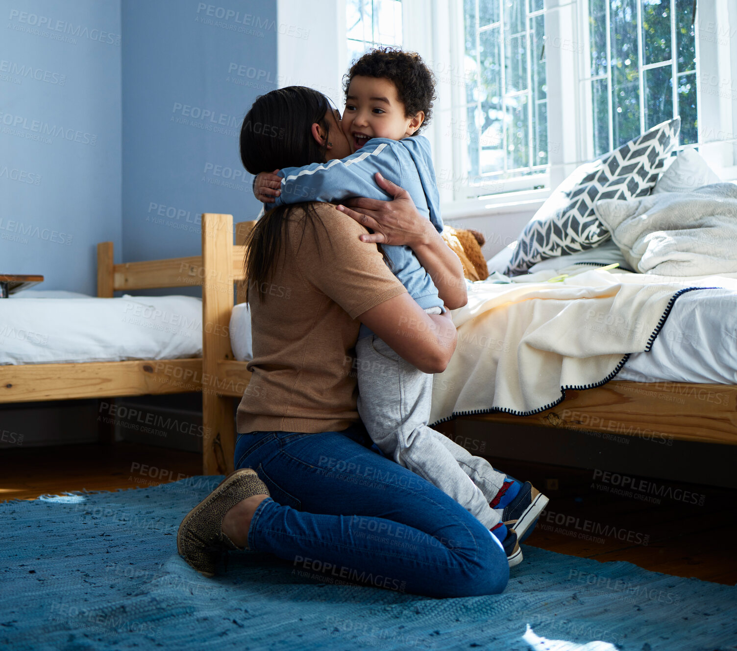 Buy stock photo Mother, boy and hug in bedroom, home and connection with love, care and happy for bonding on floor in morning. Woman, mom and child with smile, embrace or together on carpet at family house in Bogota