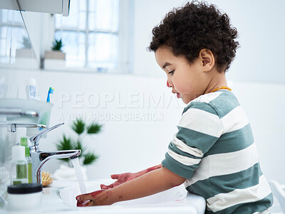 Buy stock photo Boy, child and washing hands in bathroom, home and profile with dirt, pain or stains for hygiene. Toddler, learning and cleaning routine with water, faucet and development at family house in Bogota