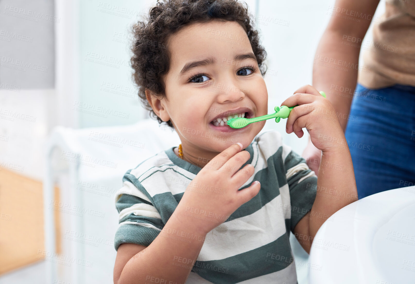 Buy stock photo Boy, child and toothbrush in bathroom, home and learn with parent, self care and dental health in morning. Kid, toddler and brushing teeth with smile in portrait, teaching or hygiene at family house