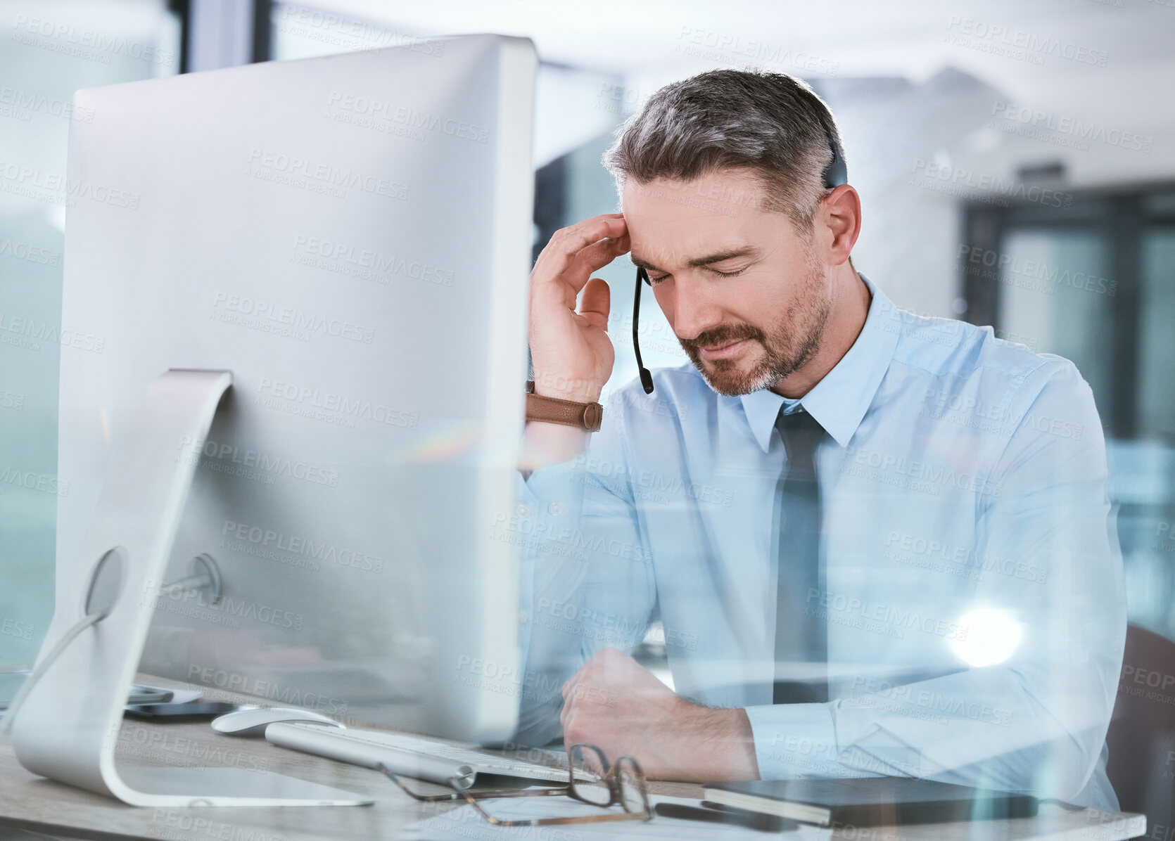 Buy stock photo Call center, stress and businessman with headache in office for telecom mistake, consulting or burnout. Desk, mature agent and frustrated in pain by monitor for customer service, complaint or fatigue