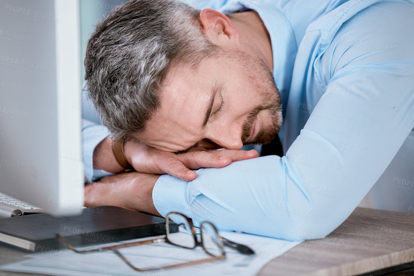 Buy stock photo Tired, sleeping and business man in office with burnout for working on deadline, project and online report. Corporate, desk and exhausted, fatigue and overworked employee with insomnia on computer