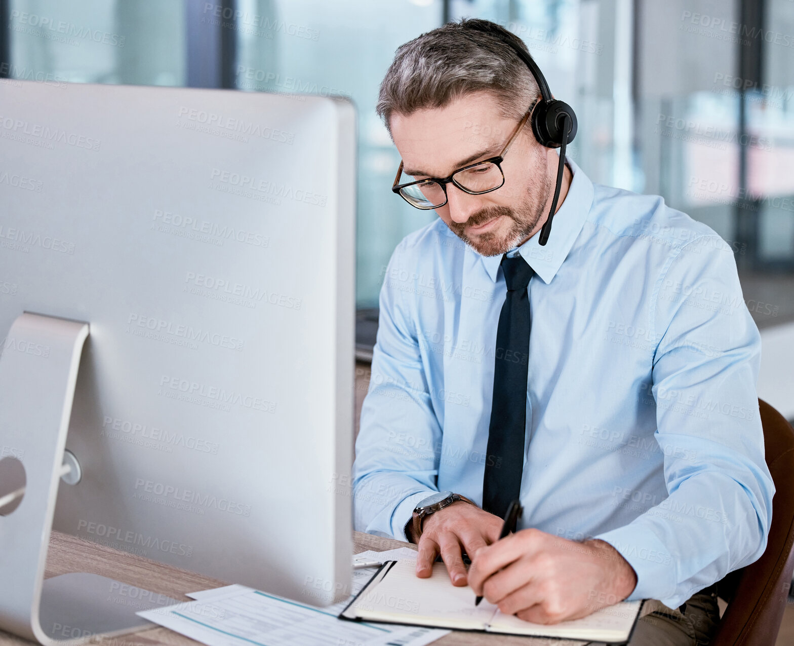 Buy stock photo Customer service, call center and man on computer for writing notes, planning and sales consulting. Corporate office, telemarketing and person with headset for contact, crm support or communication