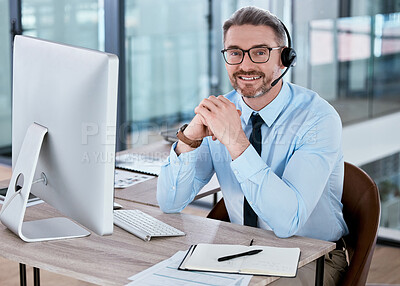 Buy stock photo Portrait of a mature call centre agent working on a computer in an office