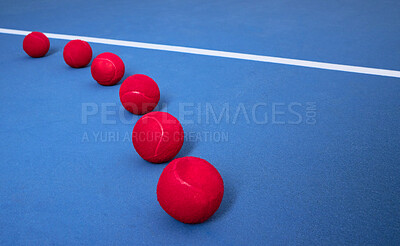 Buy stock photo Row, floor and tennis balls for game or sport, practice and training for skill development for tournament or match. Blue court or pitch, red equipment and ground for athletic activity and fitness.