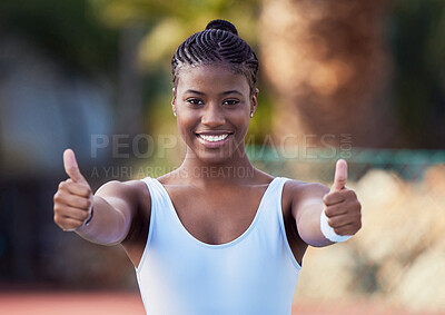 Buy stock photo Shot oa young woman showing thumbs up