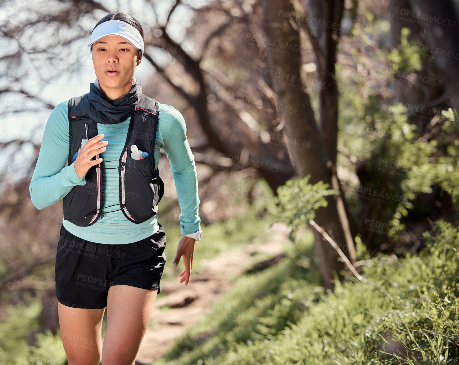 Buy stock photo Woman, running and path for outdoor cardio, endurance and mountain marathon for exercise. Female person, training practice and nature for action, forest and sports challenge for workout fitness