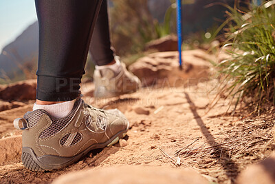 Buy stock photo Feet, hiking and walking pole on ground, direction and safety with balance, fitness and adventure on hill. Person, shoes and stick on mountain, challenge or climbing for workout on path in Argentina