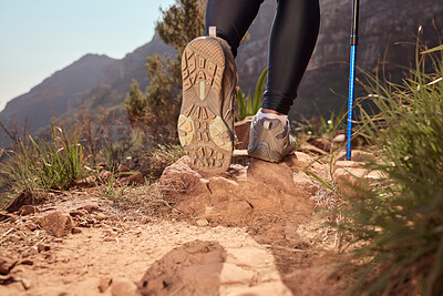 Buy stock photo Feet, hiking and walking pole on path, direction and safety with balance, fitness and adventure on hill. Person, shoes and stick on mountain, challenge or climbing for workout on ground in Argentina