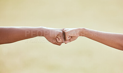Buy stock photo Cropped shot of two unrecognizable women sharing a fist bump