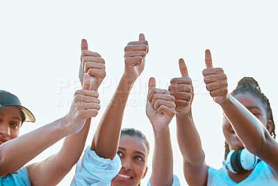 Buy stock photo Shot of a group of young women showing thumbs-up