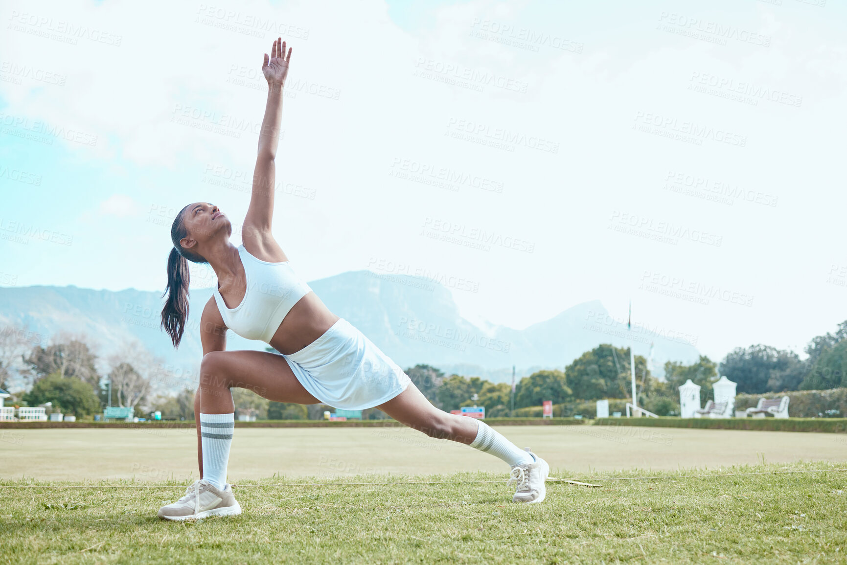 Buy stock photo Woman, stretching arms and outdoor game on field, warm up and netball player for preparation. Person, sports and exercise for flexibility or muscle relief, athlete and getting ready for training