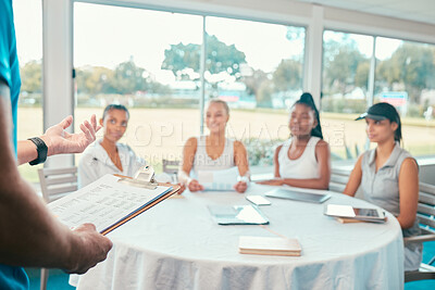Buy stock photo Shot of a diverse group of women sitting together and listening to their tennis coach