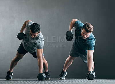 Buy stock photo Fitness, men and dumbbell push up for exercise with focus, power and strong muscle with a grey background. Friends or people at gym together for a workout, training commitment or bodybuilder goals