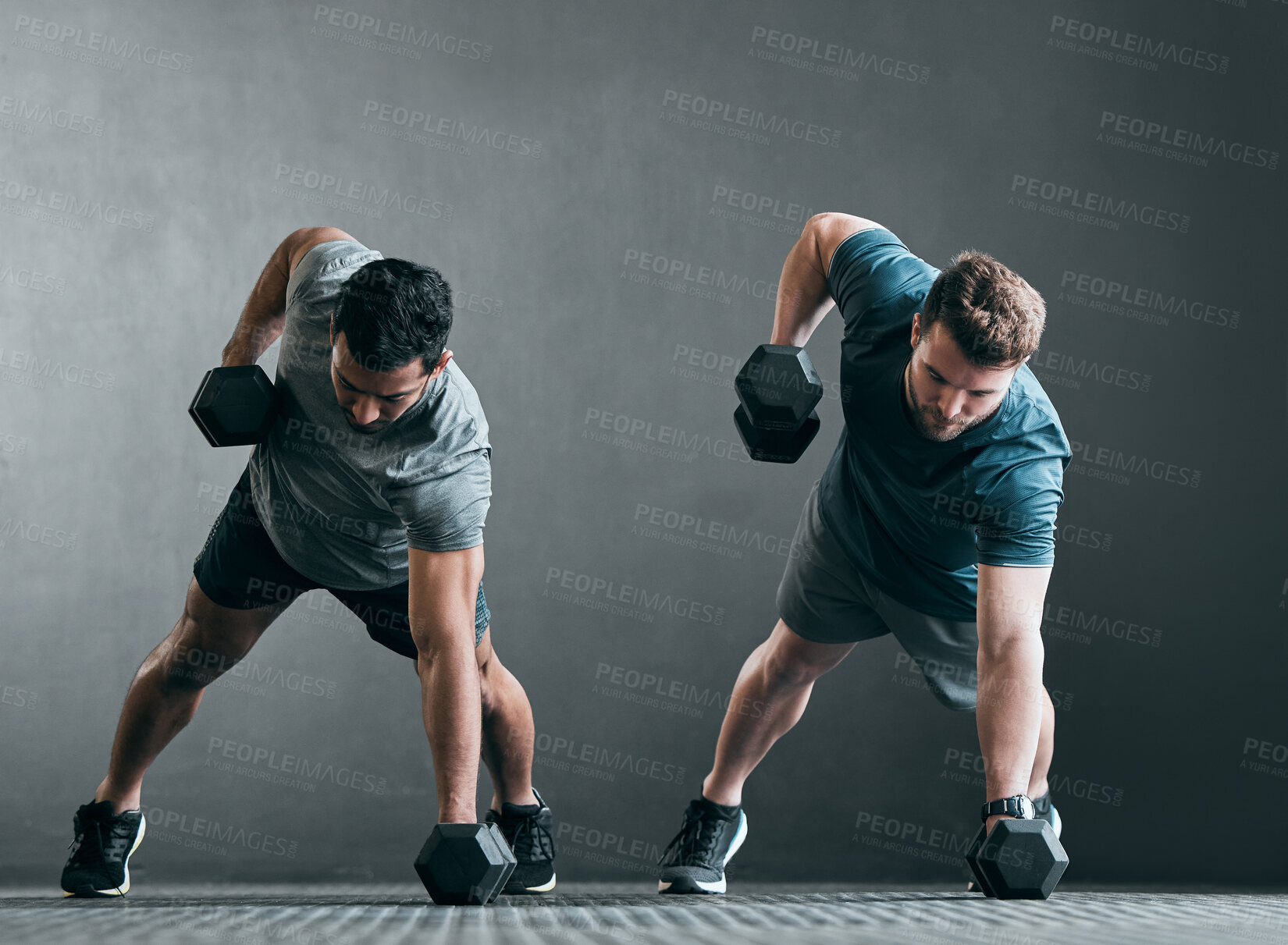 Buy stock photo Fitness, men and dumbbell push up for exercise with focus, power and strong muscle with a grey background. Friends or people at gym together for a workout, training commitment or bodybuilder goals