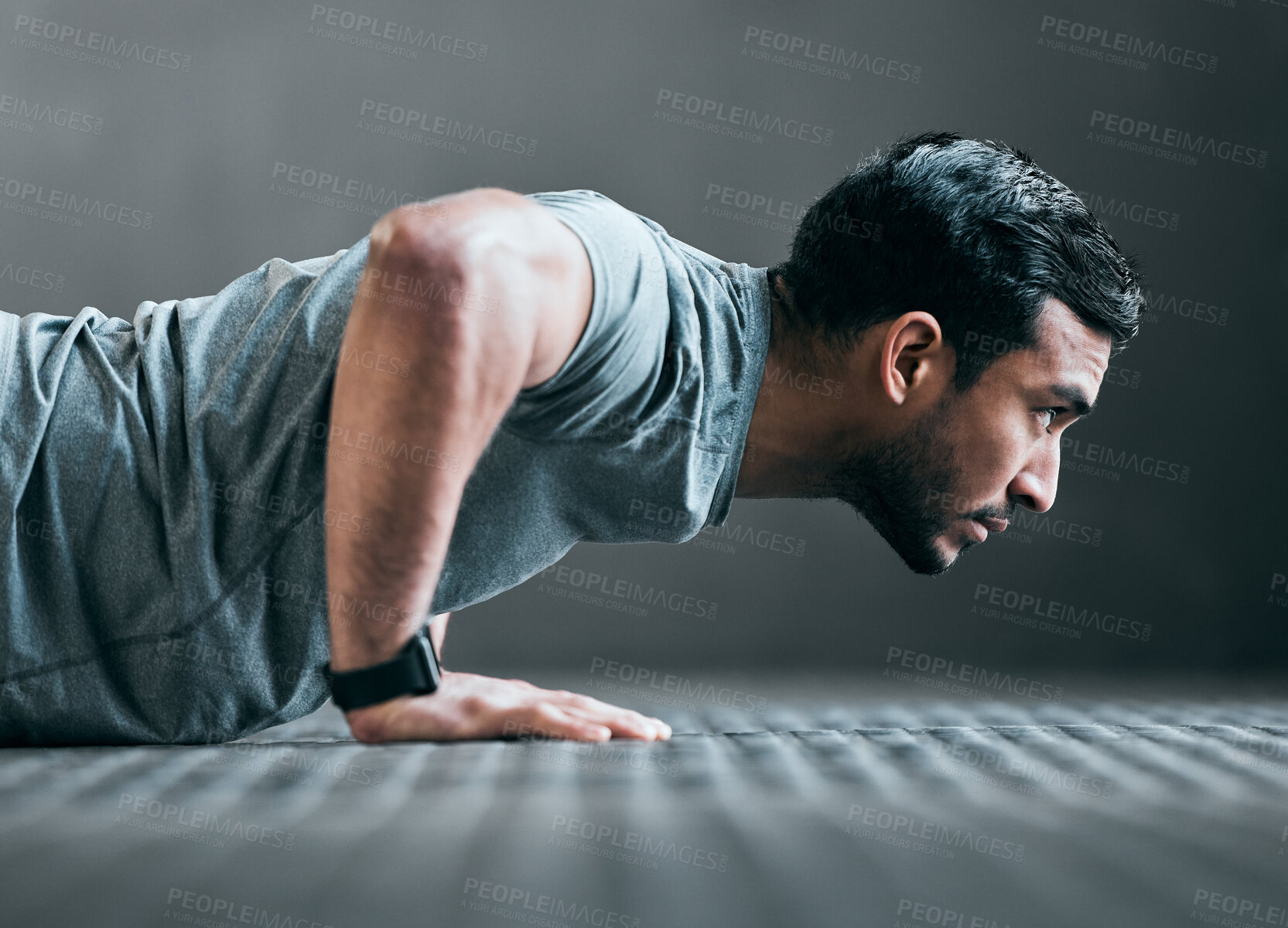 Buy stock photo Man, athlete and push up in gym for fitness, strong muscle development and intensity workout. Male person, profile and confident in exercise routine at health club, training challenge and bodybuilder