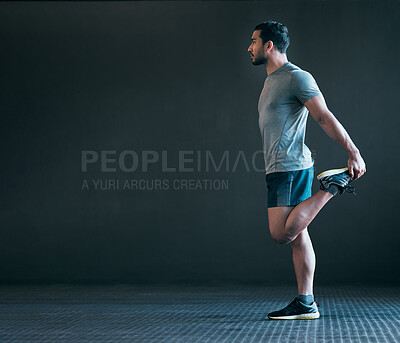 Buy stock photo Full length shot of a handsome young male athlete warming up against a grey background