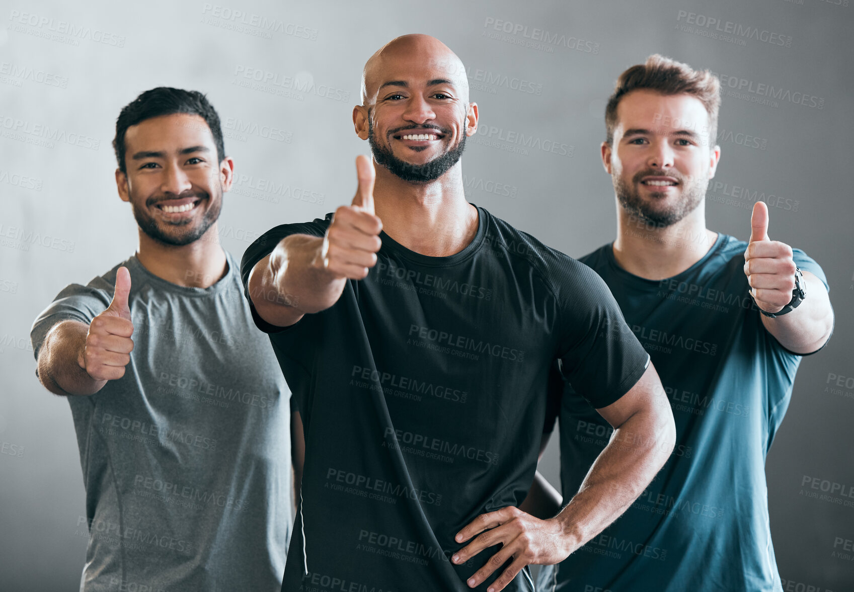 Buy stock photo Thumbs up, fitness and portrait of men in studio for confidence with workout or training group. Smile, friends and male athletes with approval hand gesture for muscle exercise by gray background.