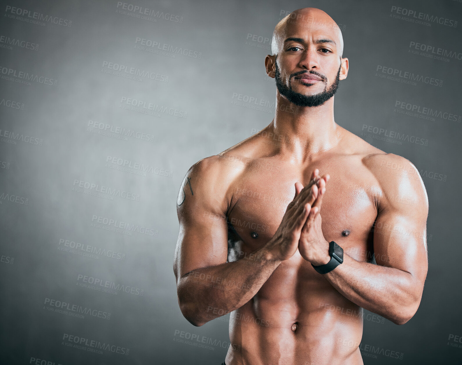 Buy stock photo Cropped portrait of a handsome young male athlete standing shirtless against a grey background