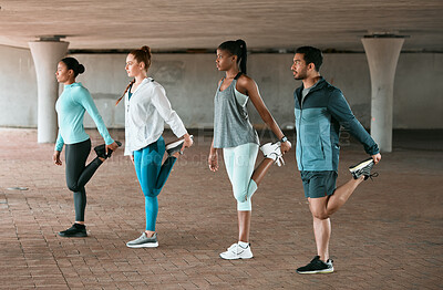 Buy stock photo Shot of a group of friends stretching before a workout
