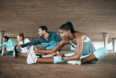 Buy stock photo Shot of a group of friends stretching together before a workout