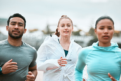 Buy stock photo Shot of a group of friends running together