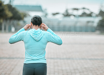 Buy stock photo Shot of a woman getting ready for a run