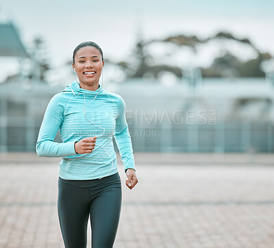 Buy stock photo Portrait, city or black woman running, exercise or training with earphones, health or cardio. Face, female person or runner with motivation, workout goal or practice with wellness, outdoor or fitness