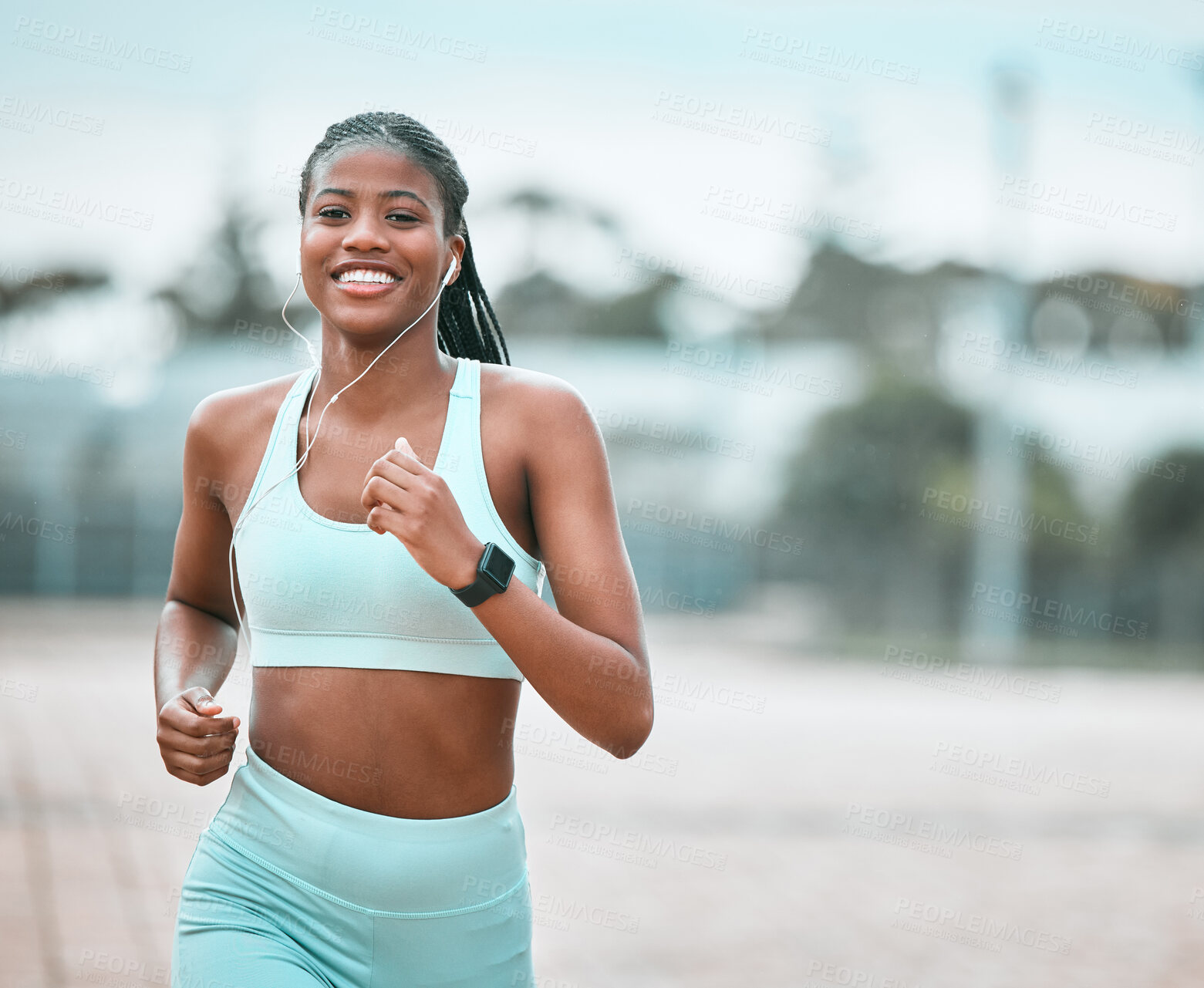 Buy stock photo Portrait, outdoor and black woman running, exercise and training for wellness, health and self care. Face, female person or runner with earphones, workout goal and athlete with music, smile or cardio