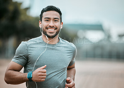 Buy stock photo Fitness, portrait and man running with earphones for music, radio or sport podcast for motivation. Sports, exercise and male athlete runner doing outdoor cardio workout for race or marathon training.
