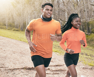 Buy stock photo Shot of two young friends running outside together during the day