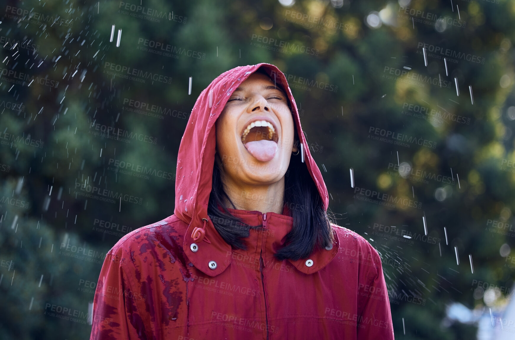 Buy stock photo Nature, outdoor and woman in rain, carefree and fun in holiday, enjoy and taste of raindrops in city. Park, girl and drinking of water in weather, raincoat and happy in Washington for tourism